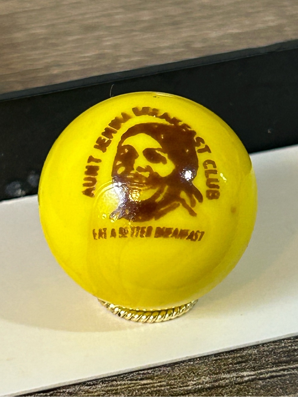 rare Aunt Jemima yellow glass marble